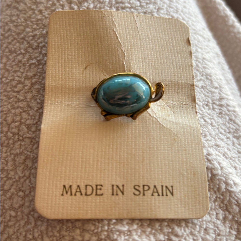 Antique brooch with blue center